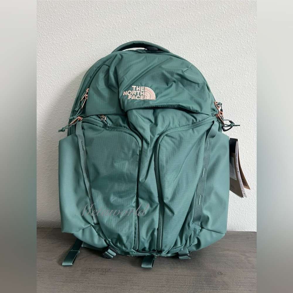 The North Face Women's Surge Luxe Backpack DARK SAGE/ BURNT